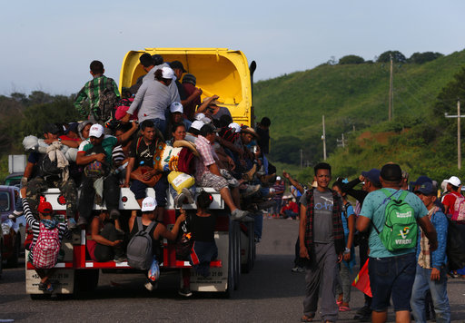 Migrants hitch rides on passing trucks, in Niltepec, Oaxaca state, Mexico, Tuesday, Oct. 30, 2018. [Photo: AP]