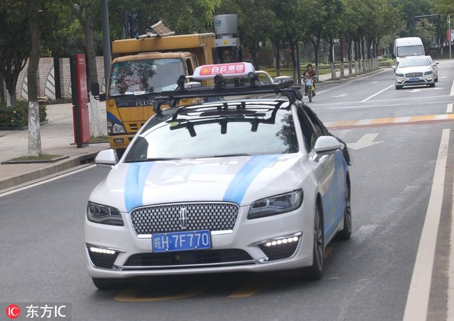 A self-driving taxi on the road in Guangzhou, Guangdong Province, seen here on Thursday, November 1, 2018. [Photo: VCG] 