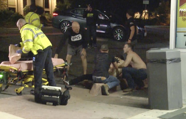 A victim is treated near the scene of a shooting, Wednesday evening, Nov. 7, 2018, in Thousand Oaks, Calif. [Photo: AP]