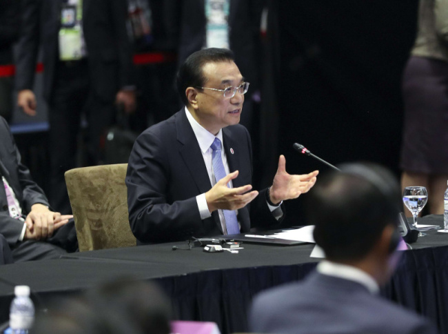Chinese Premier Li Keqiang speaks at the 21st China-ASEAN (10+1) leaders' meeting in Singapore on Wednesday, Nov. 14, 2018.[Photo: gov.cn]