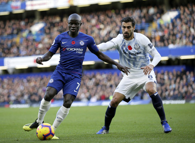 Chelsea's N'Golo Kante, left, duels for the ball with Everton's Andre Gomes during the English Premier League soccer match between Chelsea and Everton at Stamford Bridge stadium in London, Sunday, Nov. 11, 2018. [Photo: AP/Tim Ireland]