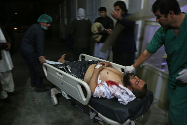 A man injured in a suicide bombing is brought into a hospital in Kabul, Afghanistan, Nov. 20, 2018. [Photo: AP/Rahmat Gul]