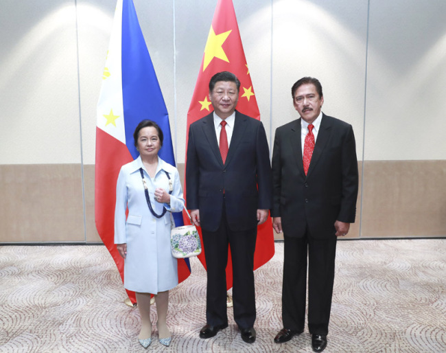 Chinese President Xi Jinping meets with the Philippines' House of Representatives Speaker Gloria Macapagal Arroyo and President of the Senate Vicente Sotto III in Manila in Manila on November 21, 2018. [Photo: Xinhua]