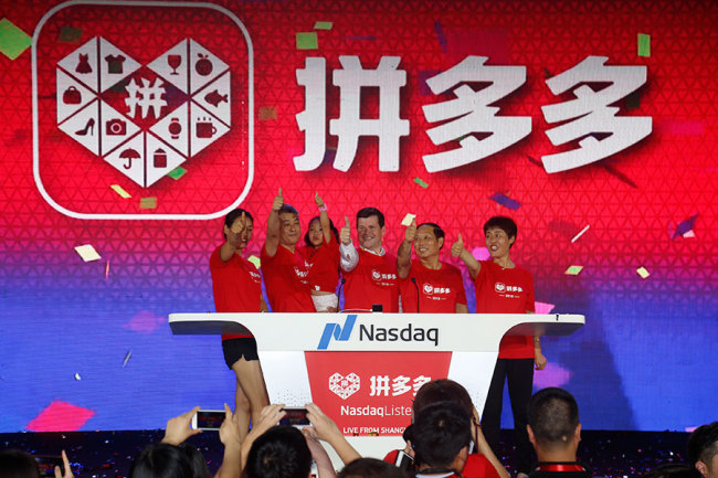 Company executives of Pinduoduo celebrate as the company gets listed on the Nasdaq on July 26. [from China Daily]