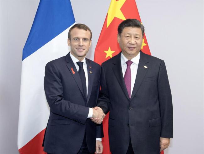 Chinese President Xi Jinping (R) meets with his French counterpart Emmanuel Macron in Buenos Aires, Argentina, Dec. 1, 2018. [Photo: Xinhua/Li Xueren]