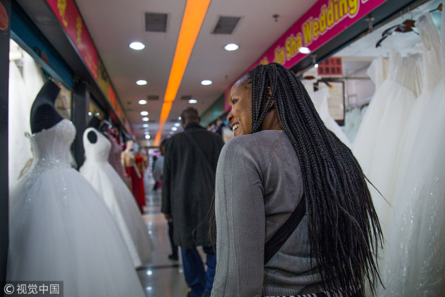 Buyers visit a wedding dress market in Guangzhou, Guangdong Province on November 26.[Photo: VCG]