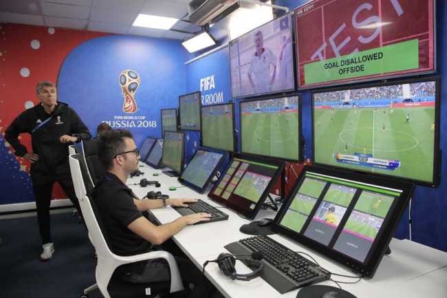 VAR refereeing Project Leader Roberto Rosetti, left, demonstrates a video operation room (VOR), a facility of the Video Assistant Referee (VAR) system which will be rolled out for the first time during theWorld Cup, at the 2018 World Cup International Broadcast Centre in Moscow, Russia, Saturday, June 9, 2018. [Photo: AP]