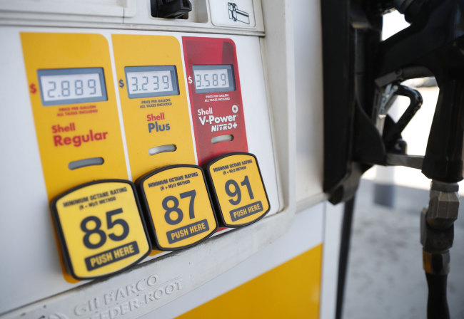 In this May 25, 2018 file photo, prices for the three grades of gasoline light up the pump at a Shell station in southeast Denver. Oil prices slipped below $50 per barrel early Thursday, Nov. 29, before edging back up following a report showing that inventories are rising again. U.S. crude oil refinery inputs averaged 17.6 million barrels per day for the week ending Nov. 23.[Photo: AP]