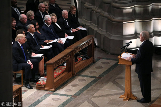 Former Canadian Prime Minister Brian Mulroney speaks as U.S. President Donald Trump and first lady Melania Trump sit with former President Barack Obama in the first row along with former first lady Michelle Obama, former President Bill Clinton and former first lady Hillary Clinton, former President Jimmy Carter and first lady Rosalynn Carter during the state funeral for former U.S. President George H.W. Bush at the Washington National Cathedral in Washington, U.S., December 5, 2018. [Photo: VCG]