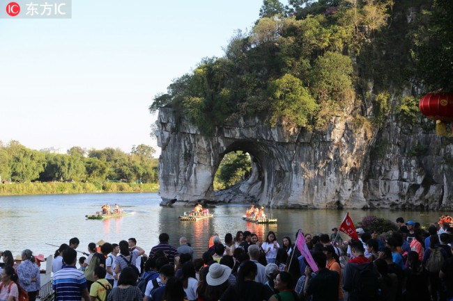 Tourists visit the Elephant Trunk Hill in Guilin, Guangxi Province. [File photo: IC]