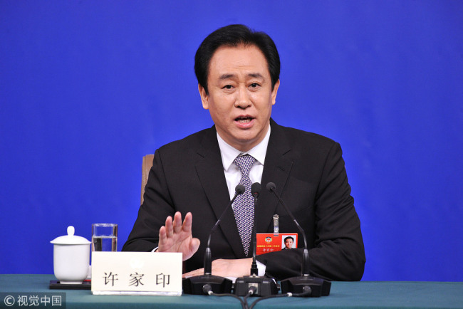 Xu Jiayin (Hui Ka Yan), chairman of Evergrande Group, answers questions from reporters in the first session of 13th National Committee of the CPPCC on March 10,2018 in Beijing. [Photo: VCG]
