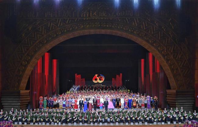 A grand gala is staged to mark the 60th anniversary of the founding of Guangxi Zhuang Autonomous Region in south China's Guangxi, Dec. 9, 2018. Wang Yang joined about 900 locals at the grand gala, which presented a feast of dancing and singing. [Photo: Xinhua/Shen Hong]