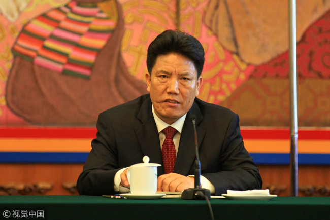 Losang Jamcan gives speech during the third session of the 12th National People's Congress on March 9th, 2015 in Beijing.
