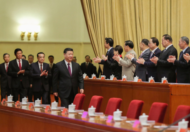 Chinese President Xi Jinping, also general secretary of the Communist Party of China (CPC) Central Committee and chairman of the Central Military Commission, attends a grand gathering to celebrate the 40th anniversary of China's reform and opening-up at the Great Hall of the People in Beijing, capital of China, Dec. 18, 2018. Xi made an important speech at the gathering. [Photo: Xinhua/Ju Peng]
