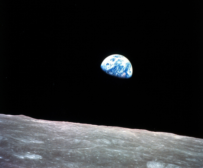 This Dec. 24, 1968, file photo made available by NASA shows the Earth behind the surface of the moon during the Apollo 8 mission. [File photo: NASA via AP/William Anders]
