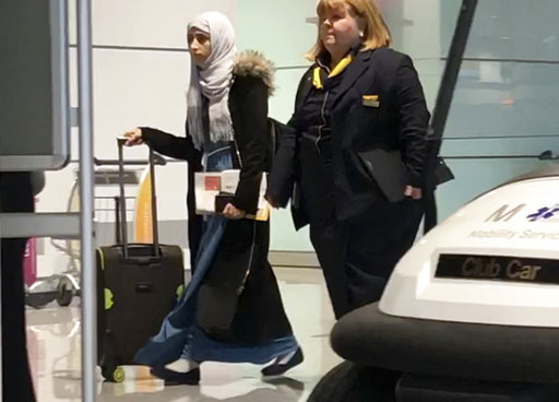 Yemeni national Shaima Swileh, left, walks through the terminal of the airport in Munich, Germany, Wednesday, Dec. 19, 2018 [Photo: AP]