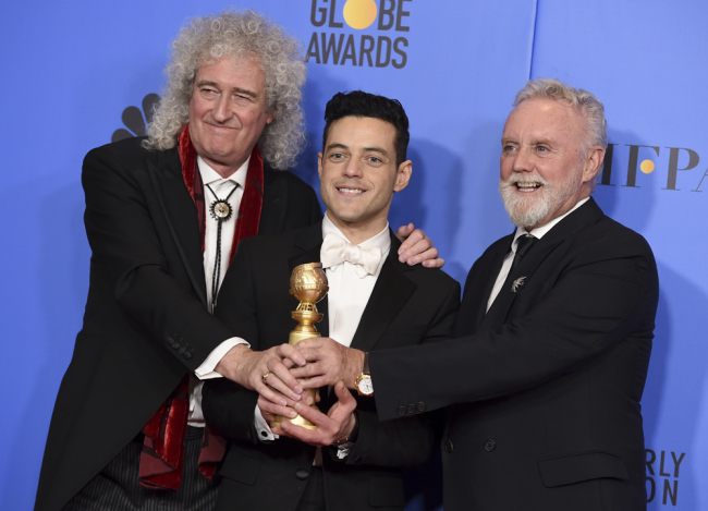 Bohemian Brian May, left, and Roger Taylor, right, of Queen, and Rami Malek pose in the press room with the award for best motion picture, drama for "Bohemian Rhapsody" at the 76th annual Golden Globe Awards at the Beverly Hilton Hotel on Sunday, Jan. 6, 2019, in Beverly Hills, Calif. [Photo: Invision/AP/Jordan Strauss]