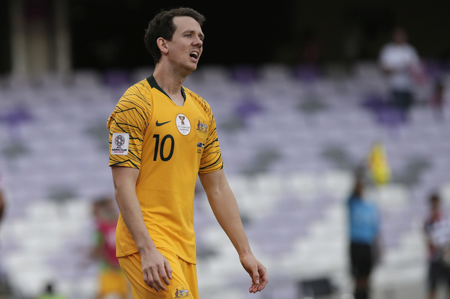 Australia's midfielder Robbie Kruse walks in dejection after Jordan's defender Anas Bani Yaseen during the AFC Asian Cup group B soccer match between Australia and Jordan at the Hazza Bin Zayed stadium in Al Ain, United Arab Emirates, Sunday, Jan. 6, 2019. [Photo: AP]