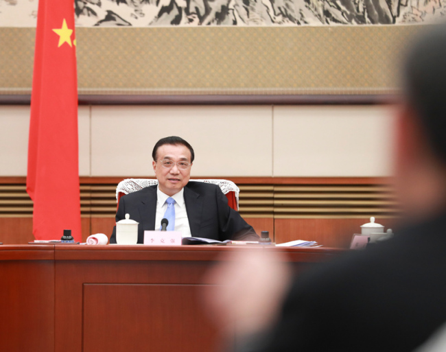 Premier Li Keqiang makes remarks when presiding over a symposium for soliciting views and suggestions on a draft version of the government work report in Beijing on January 17, 2019. [Photo: gov.cn]