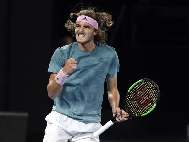 Greece's Stefanos Tsitsipas reacts after winning a point against Switzerland's Roger Federer during their fourth round match at the Australian Open tennis championships in Melbourne, Australia, Sunday, Jan. 20, 2019. [Photo: AP/ Mark Schiefelbein]