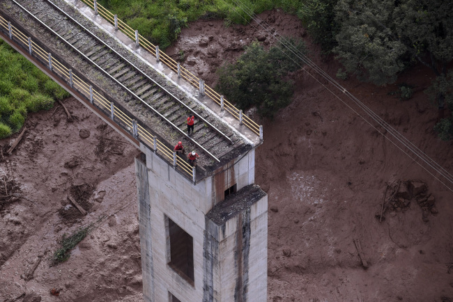 Aerial view of a fallen bridge taken after the collapse of a dam which belonged to Brazil's giant mining company Vale, near the town of Brumadinho in southeastern Brazil, on January 25, 2019. [Photo: AFP]