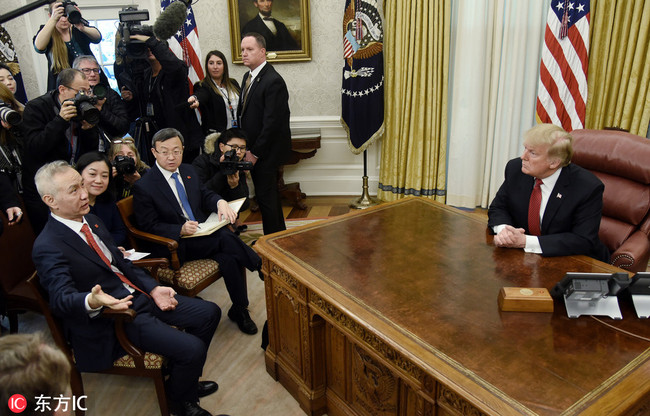 U.S. President Donald Trump (R) listens to Chinese Vice Premier Liu He (L) during a meeting to discuss trade issues in the Oval Office of the White House in Washington, DC. on January 31, 2019. [Photo: ABACAPRESS.COM via IC/Olivier Douliery]