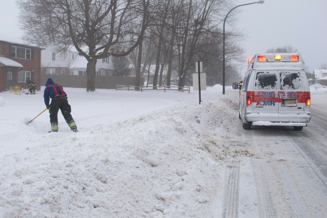 Emergency crews responding to a medical call shovel a path to the woman's apartment, Wednesday, Jan. 30, 2019 in Lackawanna, New York. The area was under a blizzard warning and officials urged people to stay inside and out of wind-driven snow and sub-zero wind chills. [Photo: AP/Carolyn Thompson]