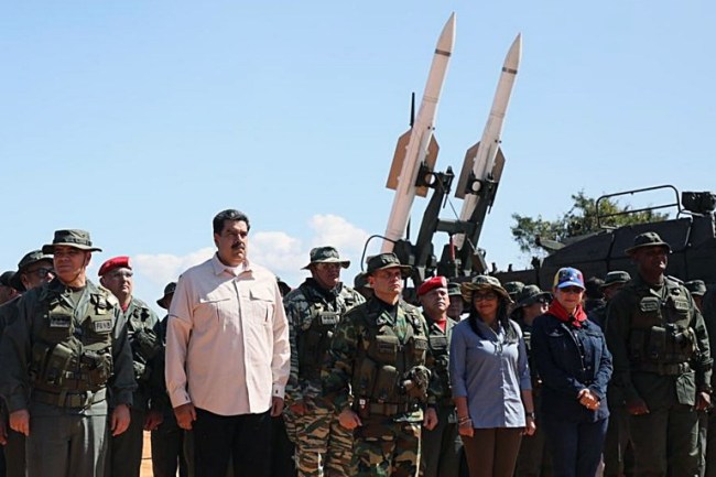 This handout photo released by the Venezuelan Presidency press office shows (L to R) Defense Minister Vladimir Padrino, President Nicolas Maduro, the Commandant of the Armed Forces Strategic Command Operations Remigio Ceballos, Vice-President Delcy Rodriguez, First Lady Cilia Flores and General Jesus Suarez Chourio, General Commander of the Bolivarian National Armed Forces, attending military exercises at Fort Guaicaipuro in Miranda state, Venezuela, on February 10, 2019. [Photo: AFP]