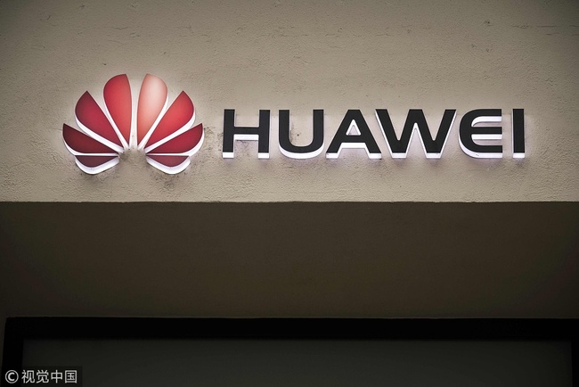 A picture taken on February 4, 2019 shows the Huawei logo above the entrance of a Huawei store in Paris. [Photo: VCG]