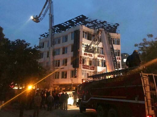 In this photo provided by Sivanand Chand, a hotel guest who was rescued, firefighters rescue people during an early morning fire at the Arpit Palace Hotel in the Karol Bagh neighborhood of New Delhi, India, Tuesday, Feb.12, 2019. More than a dozen people were killed. [Photo: AP]