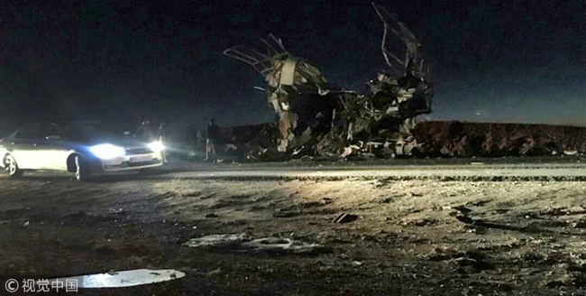 A handout picture released by the Iranian news agency Fars News on February 13, 2019, shows a bus that was reportedly blown up by a suicide attack in southeastern Iran on February 13, 2019. [Photo: VCG]