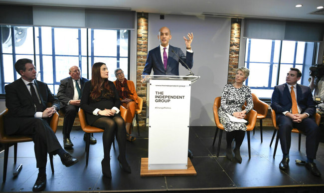 Labour MP Chuka Umunna, center, speaks to the media during a press conference with a group of six other Labour MPs, in London, Monday, Feb. 18, 2019. Seven British lawmakers say they are quitting the main opposition Labour Party over its approach to issues including Brexit and anti-Semitism. Many Labour lawmakers are unhappy with the party's direction under leader Jeremy Corbyn. [Photo: AP/Stefan Rousseau/PA]
