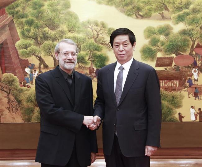 Li Zhanshu (R), chairman of the National People's Congress (NPC) Standing Committee, holds talks with Iranian Parliament Speaker Ali Larijani at the Great Hall of the People in Beijing, capital of China, Feb. 19, 2019. [Photo: Xinhua/Pang Xinglei]