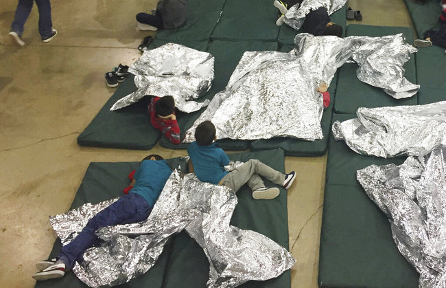 In this June 17, 2018 file photo provided by U.S. Customs and Border Protection, people who've been taken into custody related to cases of illegal entry into the United States, rest in one of the cages at a facility in McAllen, Texas. Months after the Trump administration ended the general policy of separating parents and children, advocates and members of Congress are questioning the treatment of children who cross the U.S.-Mexico border with other relatives - grandparents, uncles and aunts, and adult siblings. [Photo: AP]