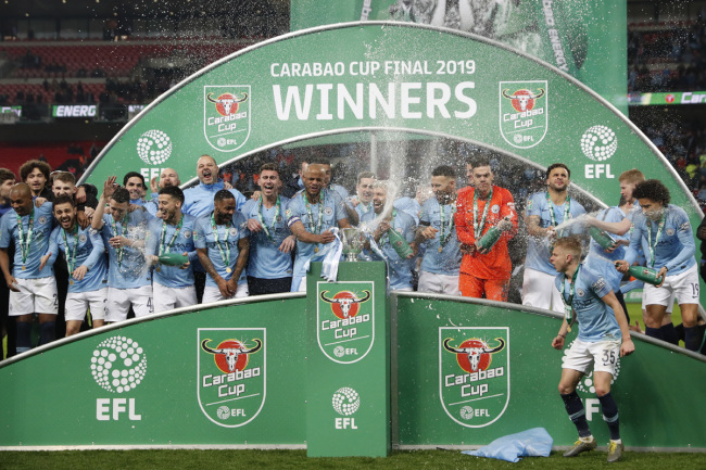 Manchester City's player celebrate after winning the English League Cup final soccer match between Chelsea and Manchester City at Wembley stadium in London, England, Sunday, Feb. 24, 2019. [Photo: AP]