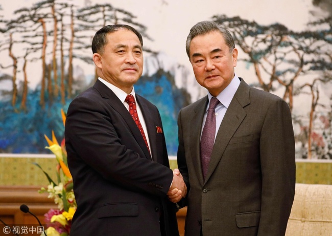 Chinese Foreign Minister Wang Yi (center) meets with Ri Kil Song (left), vice foreign minister of North Korea, in Beijing, Feb. 28, 2019. [Photo: VCG] 