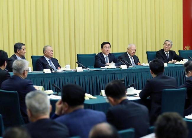 Chinese Vice Premier Han Zheng, also a member of the Standing Committee of the Political Bureau of the Communist Party of China (CPC) Central Committee, joins a panel discussion with political advisors from Hong Kong and Macao special administrative regions at the second session of the 13th National Committee of the Chinese People's Political Consultative Conference (CPPCC) in Beijing, capital of China, March 4, 2019. [Photo: Xinhua/Liu Weibing]