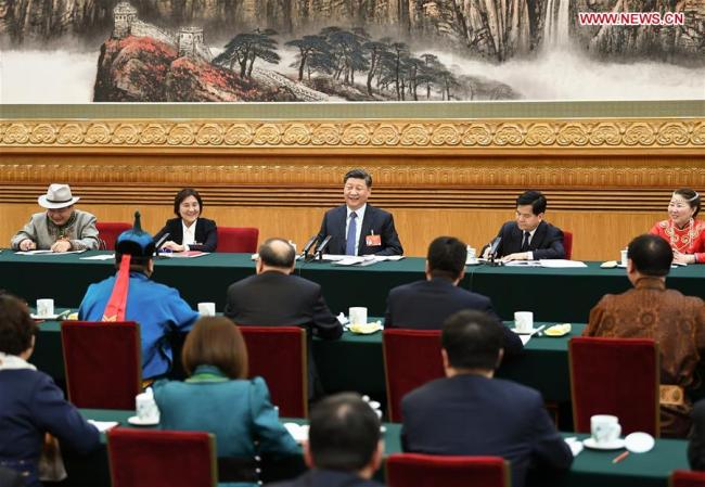 Chinese President Xi Jinping, also general secretary of the Communist Party of China (CPC) Central Committee and chairman of the Central Military Commission, attends a panel discussion with his fellow deputies from Inner Mongolia Autonomous Region at the second session of the 13th National People's Congress in Beijing, capital of China, March 5, 2019. [Photo: Xinhua]