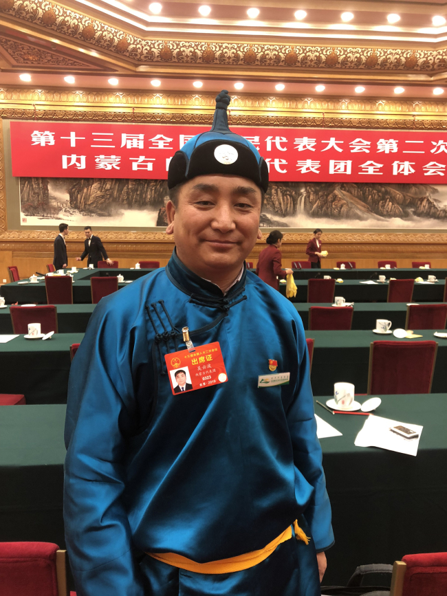 NPC Deputy Wu Yunbo says that President Xi Jinping has expressed support for his cattle cooperative and called for similar ones to be established as a means of sustaining local economic development. [Photo: China Media Group]