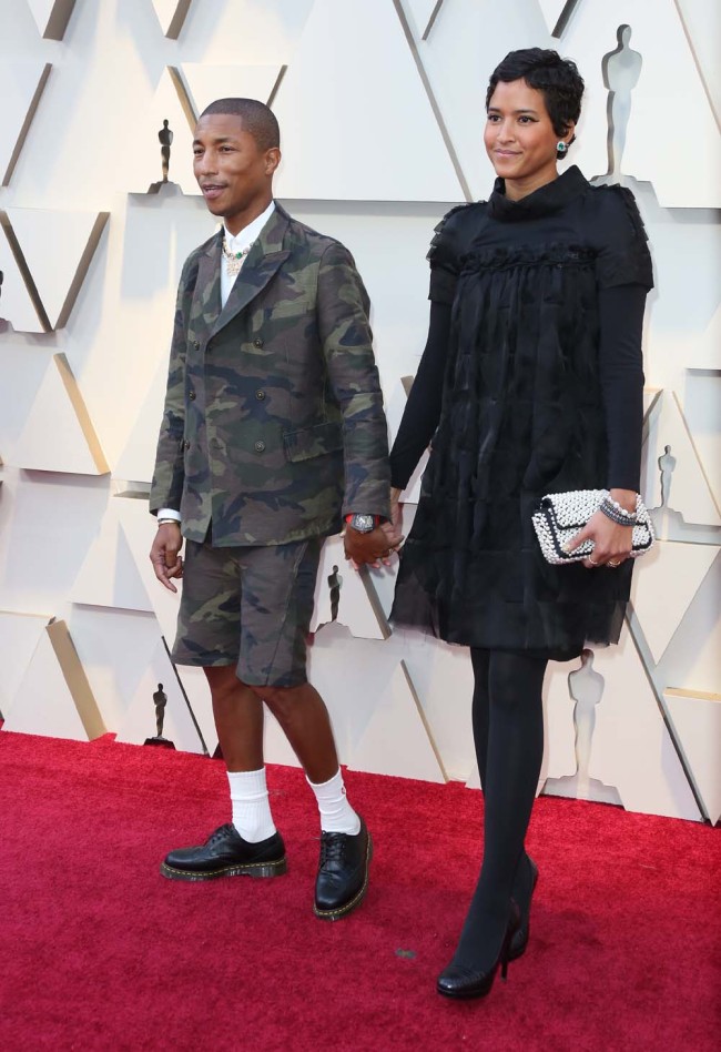 Pharrell Williams, left, and Helen Lasichanh arrive at the Oscars on Sunday, Feb. 24, 2019, at the Dolby Theatre in Los Angeles. [Photo: IC]