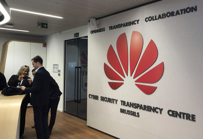 Journalists visit the new cybersecurity center of Chinese tech company Huawei, in Brussels, Tuesday March 5, 2019. Chinese tech giant Huawei is opening a cybersecurity lab in Brussels, as it tries to win over European Union leaders in a geopolitical battle with the U.S. over allegations its equipment poses a national security risk. [Photo: AP/Kelvin Chan]