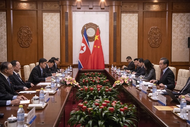 North Korean Foreign Minister Ri Yong Ho (2-L) and China's Foreign Minister Wang Yi (R) speak during a meeting at the Diaoyutai State Guesthouse in Beijing, China, 07 December 2018. [File Photo: IC]