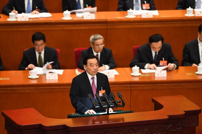 Wang Chen, vice chairman of the National People's Congress (NPC) Standing Committee, makes an explanation on the draft foreign investment law during a meeting of the NPC in Beijing, March 8, 2019. [Photo: AFP]