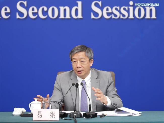 Governor of the People's Bank of China Yi Gang attends a press conference on the financial reform and development for the second session of the 13th National People's Congress (NPC) in Beijing, capital of China, March 10, 2019. [Photo: Xinhua/Shen Bohan]
