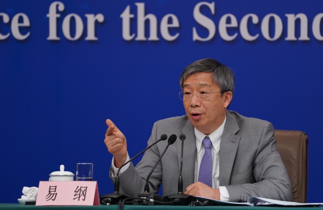 Governor of the People's Bank of China Yi Gang attends a press conference on the financial reform and development for the second session of the 13th National People's Congress (NPC) in Beijing, capital of China, March 10, 2019. [Photo: China Plus]