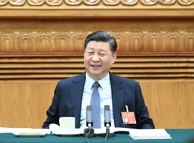 President Xi Jinping attends a panel discussion with his fellow deputies from Henan Province at the second session of the 13th National People's Congress in Beijing on March 8, 2019. [Photo: Xinhua]
