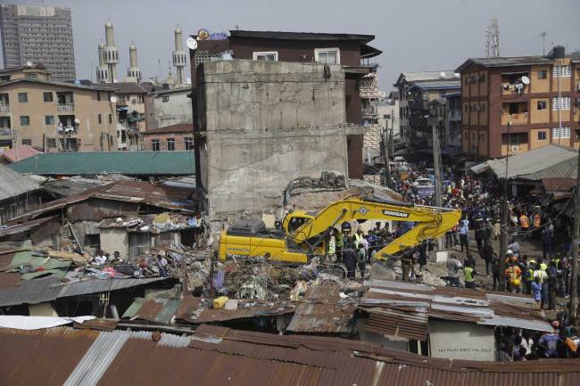 Emergency workers attend the scene of a collapsed building in Lagos, Nigeria, Thursday March 14, 2019. [Photo: AP/Sunday Alamba]