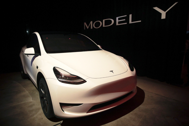 Tesla's Model Y is displayed at Tesla's design studio Thursday, March 14, 2019, in Hawthorne, Calif. The Model Y may be Tesla's most important product yet as it attempts to expand into the mainstream and generate enough cash to repay massive debts that threaten to topple the Palo Alto, California, company. [Photo: AP/Jae C. Hong]