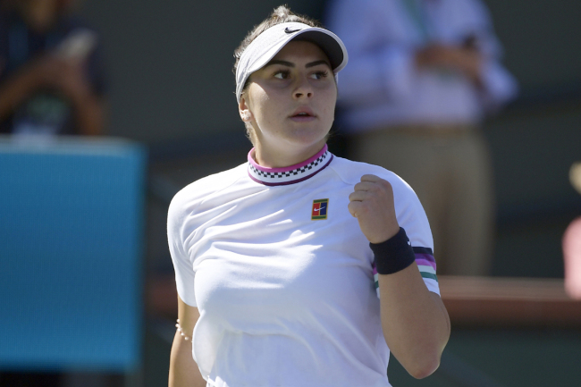 Bianca Andreescu, of Canada, celebrates a point against Garbine Muguruza, of Spain, at the BNP Paribas Open tennis tournament, Wednesday, March 13, 2019, in Indian Wells, Calif. [Photo: AP]