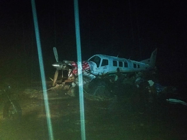 A photo released by Indonesia's National Disaster Management Agency shows a plane surrounded by flood waters in Sentani, near Jayapura, Papua province, Indonesia, 17 March 2019. [Photo: IC]